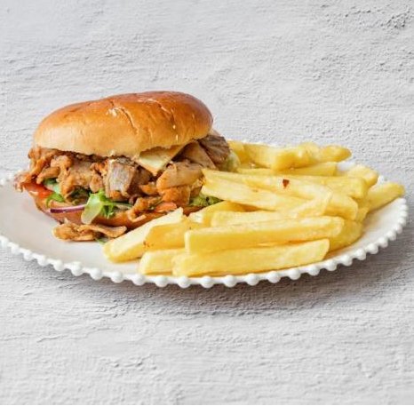 Mr Gyros in Glasgow gyro meat burger in a bun served with a side of golden french fries.